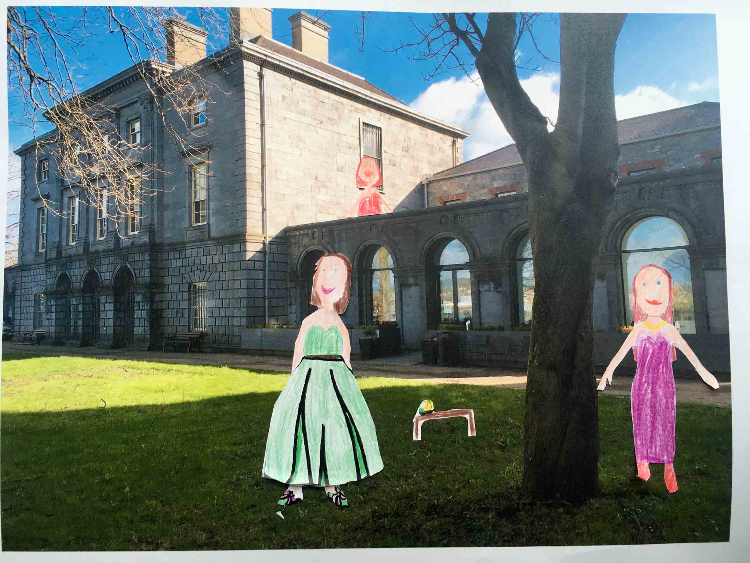 Family Costume Design. Paper cutout drawings of people in dresses are stuck down onto a picture of the Hunt Musuem